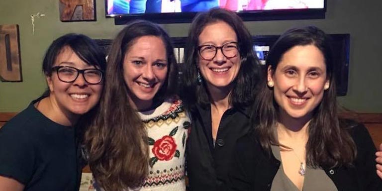 Professor Kimberly Geeslin with former linguistics graduate students. From left: Avizia Long, Rebecca Ronquest, Professor Geeslin, and Silvina Bongiovanni.