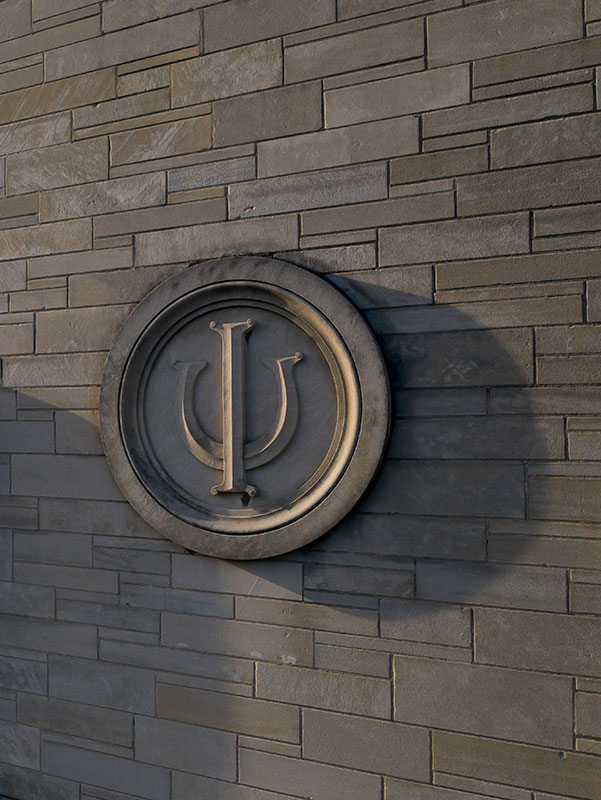 The IU trident in a limestone wall.

